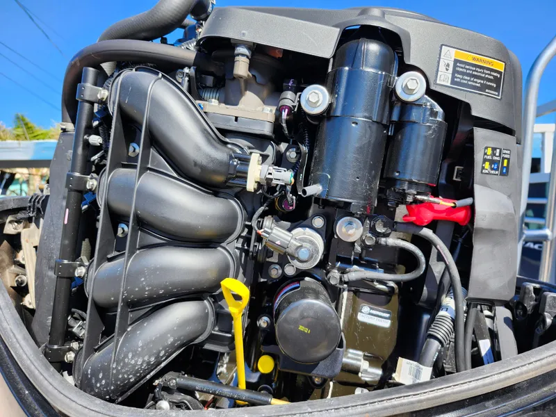 Slide: The Image of Close-up of a 2023 Sun Tracker Fishin' Barge 20 DLX engine components. - 41