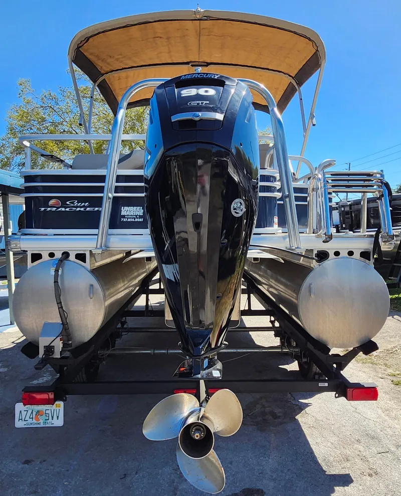 Slide: The Image of 2023 Sun Tracker Fishin' Barge 20 DLX pontoon boat with powerful outboard motor. - 5