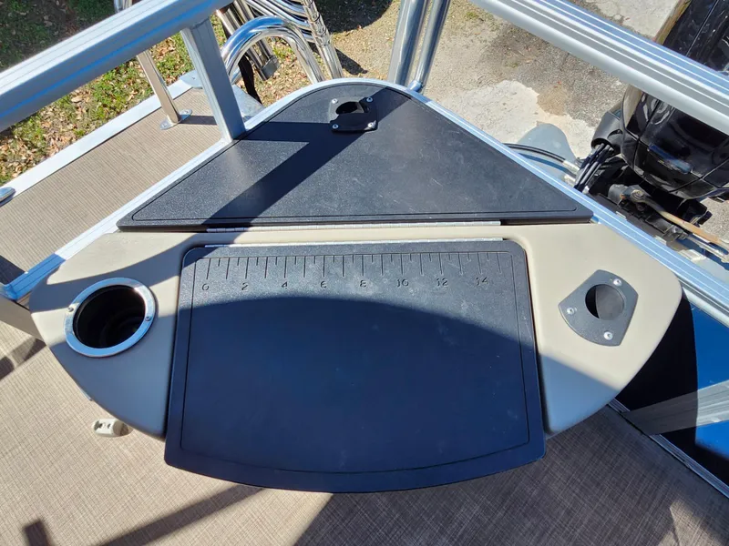 Slide: The Image of 2023 Sun Tracker Fishin' Barge 20 DLX fishing station with cup holder and measuring board. - 9