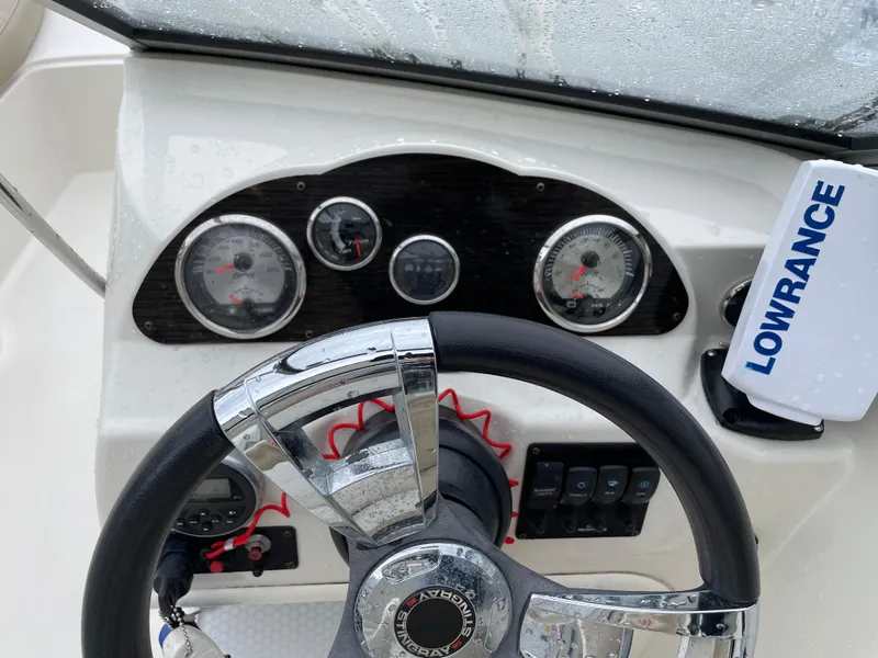 Slide: The Image of 2017 Stingray 191 DC dashboard with steering wheel and Lowrance device. - 11