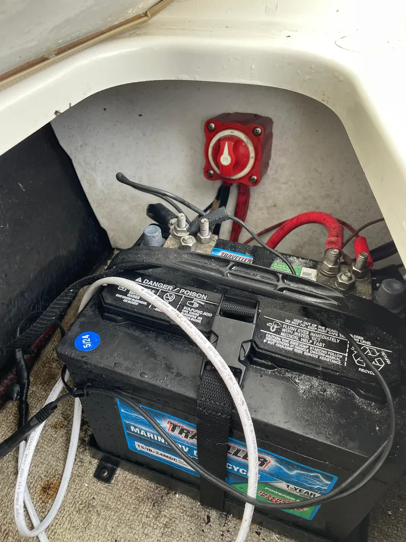 Slide: The Image of Marine battery setup in a 2017 Stingray 191 DC boat, featuring wiring and a power switch. - 19