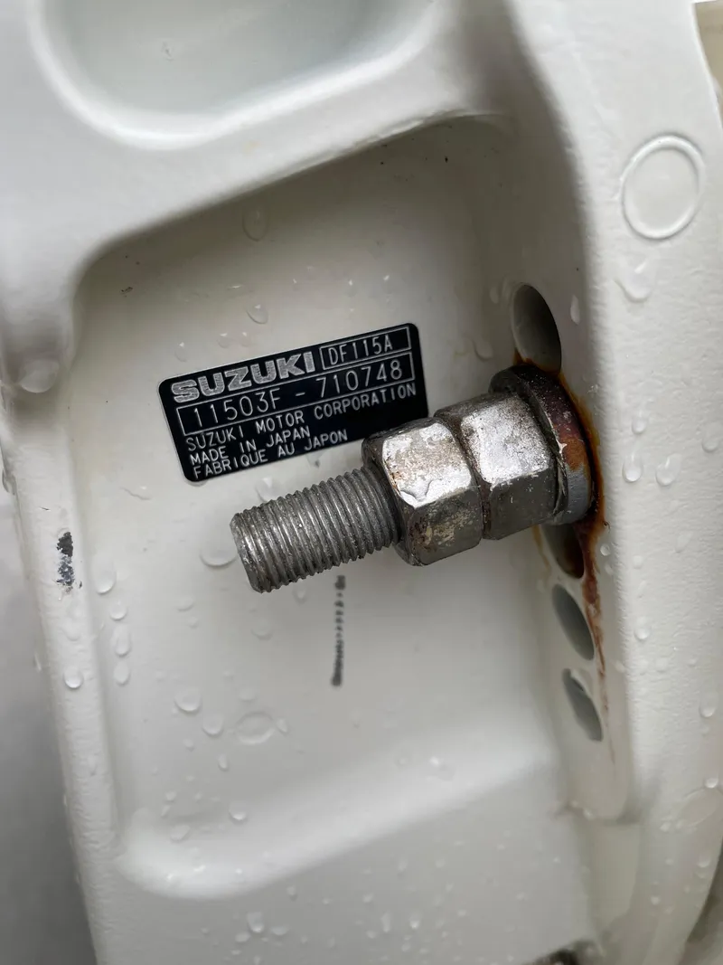 Slide: The Image of Close-up of a Suzuki DF115A motor part on a 2017 Stingray 191 DC boat. - 23