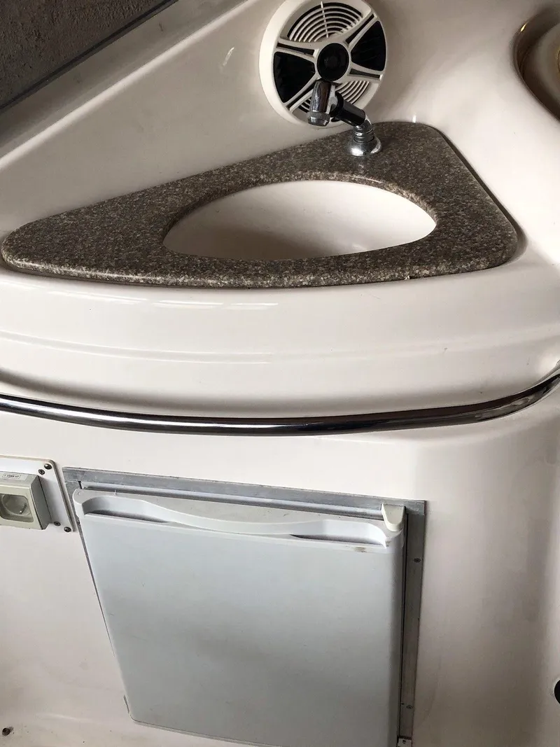 Slide: The Image of 2008 Chaparral 310 Signature boat interior with sink and speaker. - 13