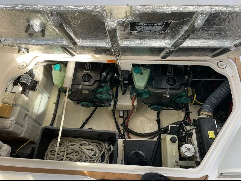 Slide: The Image of Engine compartment of a 2008 Chaparral 310 Signature boat, showing dual engines and equipment. - 17