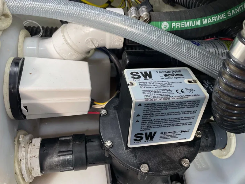 Slide: The Image of Vacuum pump system in a 2008 Chaparral 310 Signature boat engine compartment. - 19