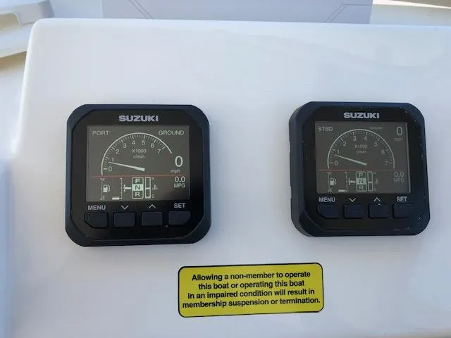 Slide: The Image of Digital gauges on a 2022 May-Craft 2700 Pilot House boat dashboard. - 10