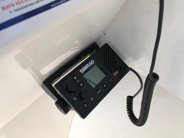 Slide: The Image of Simrad marine radio installed in a 2022 May-Craft 2700 Pilot House boat. - 13