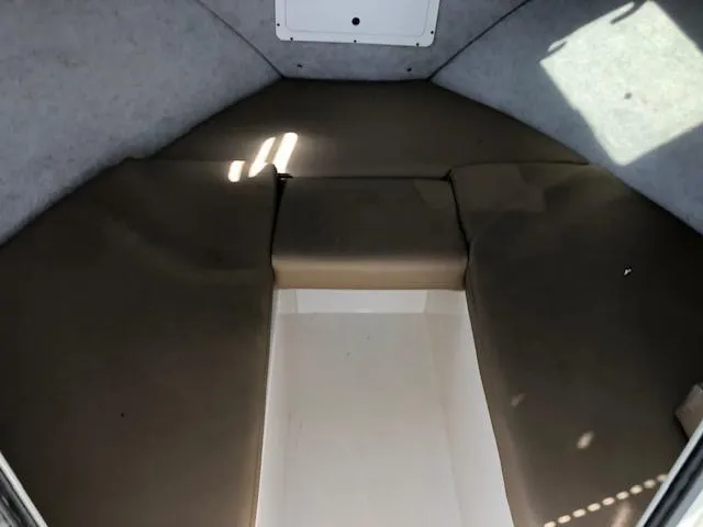 Slide: The Image of 2022 May-Craft 2700 Pilot House interior cabin with cushioned seating. - 20