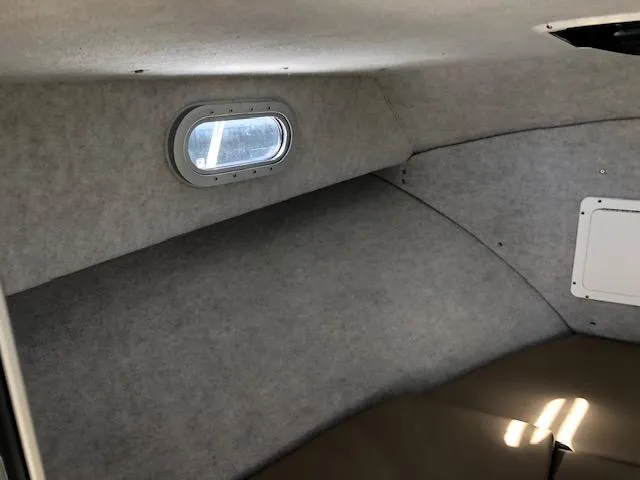 Slide: The Image of Interior cabin of 2022 May-Craft 2700 Pilot House with small window. - 21