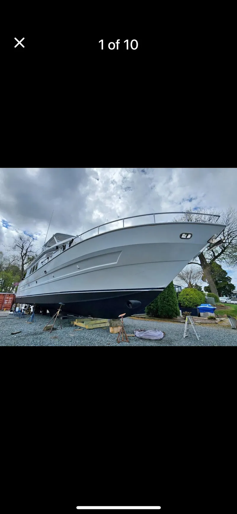 Slide: The Image of Tarrab 1997 motor yacht on land, cloudy sky background. - 2
