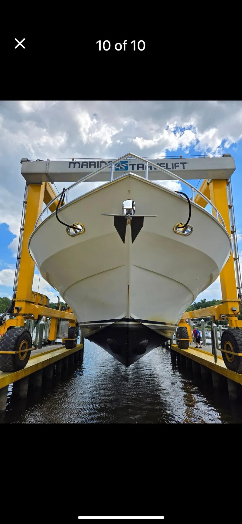 Slide: The Image of Tarrab 1997 motor yacht in dry dock, supported by a marine travel lift. - 8