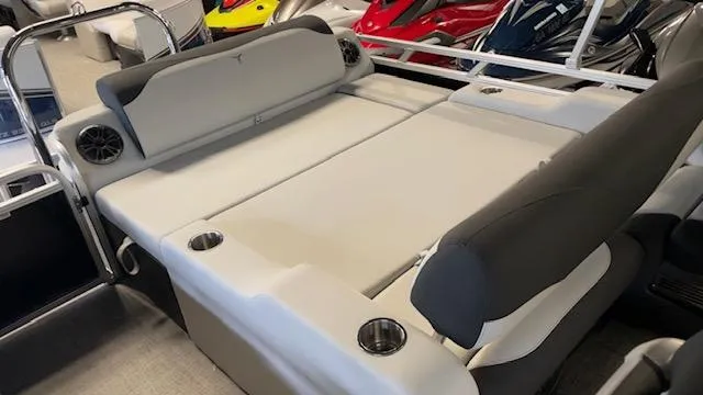 Slide: The Image of 2025 Tahoe LTZ 2385 VRL boat interior with comfortable seating and cup holders. - 13