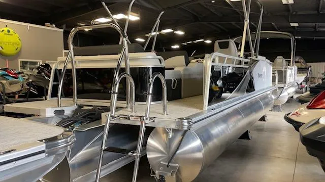 Slide: The Image of 2025 Tahoe LTZ 2385 VRL pontoon boat in showroom, featuring sleek aluminum design. - 3