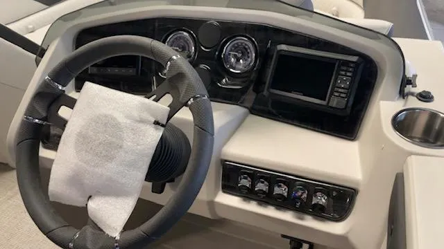 Slide: The Image of Steering console of 2025 Tahoe LTZ 2385 VRL boat with modern controls and dashboard. - 7