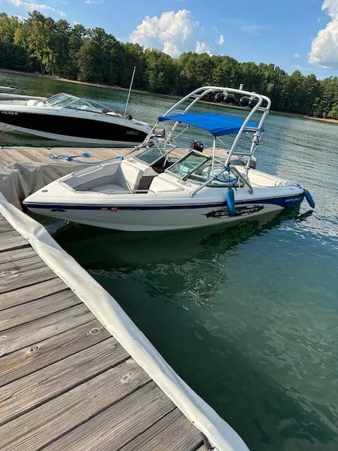 Slide: The Image of 2007 Ski Centurion T-5 Competition boat docked on a serene lake. - 1