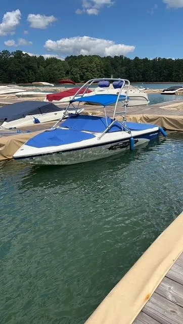 Slide: The Image of 2007 Ski Centurion T-5 Competition boat docked on a sunny day. - 2