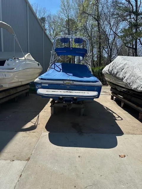 Slide: The Image of 2007 Ski Centurion T-5 Competition boat in storage, surrounded by other boats. - 4