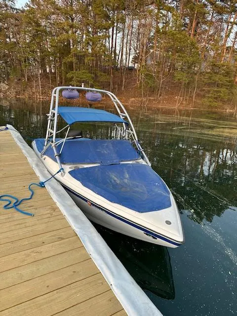 Slide: The Image of 2007 Ski Centurion T-5 Competition boat docked on a serene lake. - 6