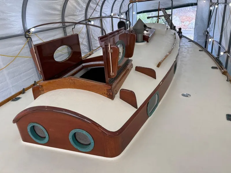 Slide: The Image of 1955 Concordia 39 Yawl with wooden deck and classic design in covered storage. - 12