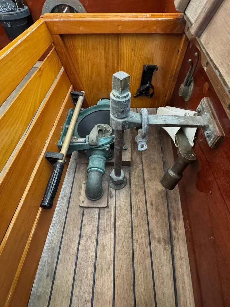 Slide: The Image of Vintage 1955 Concordia 39 Yawl interior with wooden and metal nautical equipment. - 18