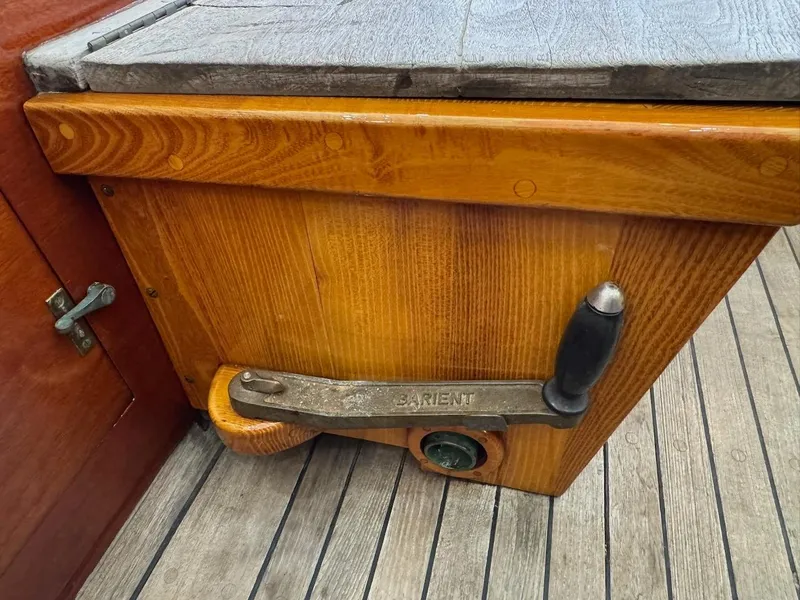 Slide: The Image of Wooden deck detail of a 1955 Concordia 39 Yawl with a Barient winch handle. - 20
