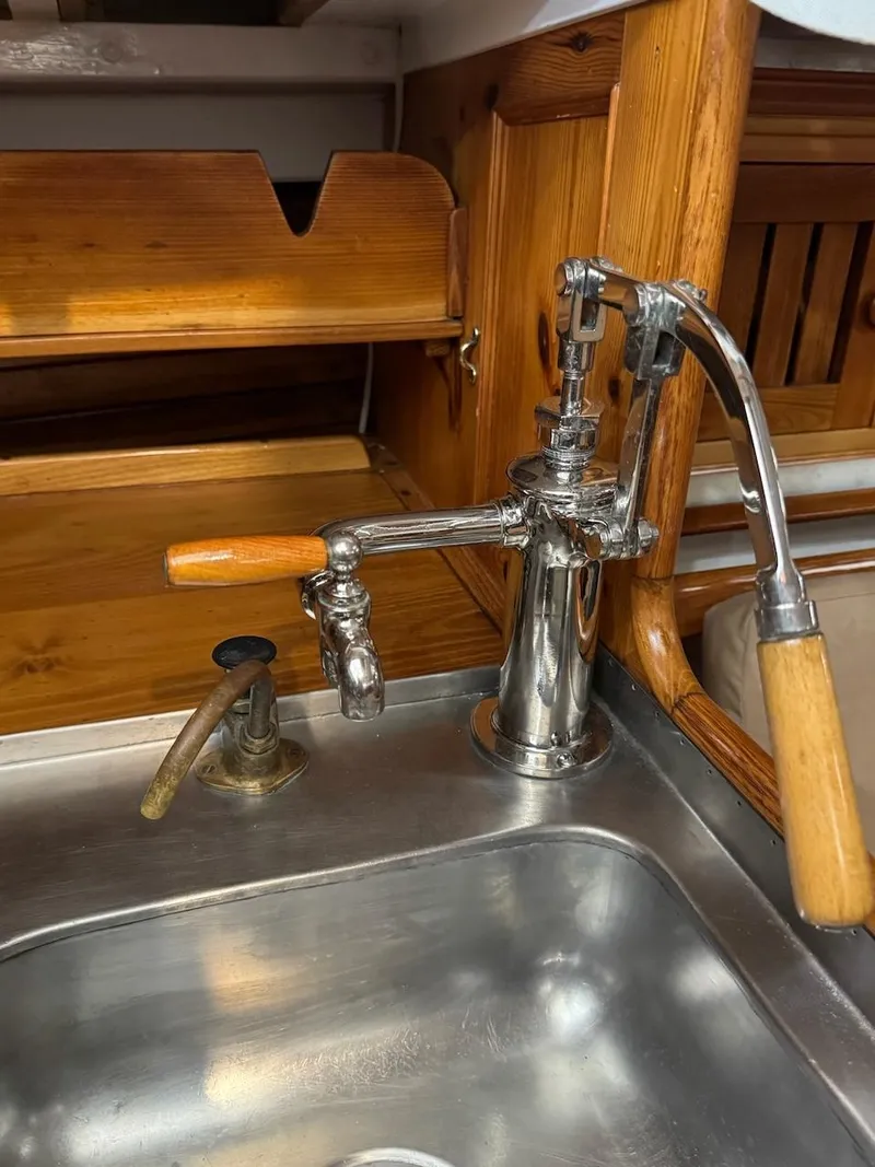 Slide: The Image of Vintage Concordia 39 Yawl kitchen sink with wooden and metal fixtures, 1955. - 27