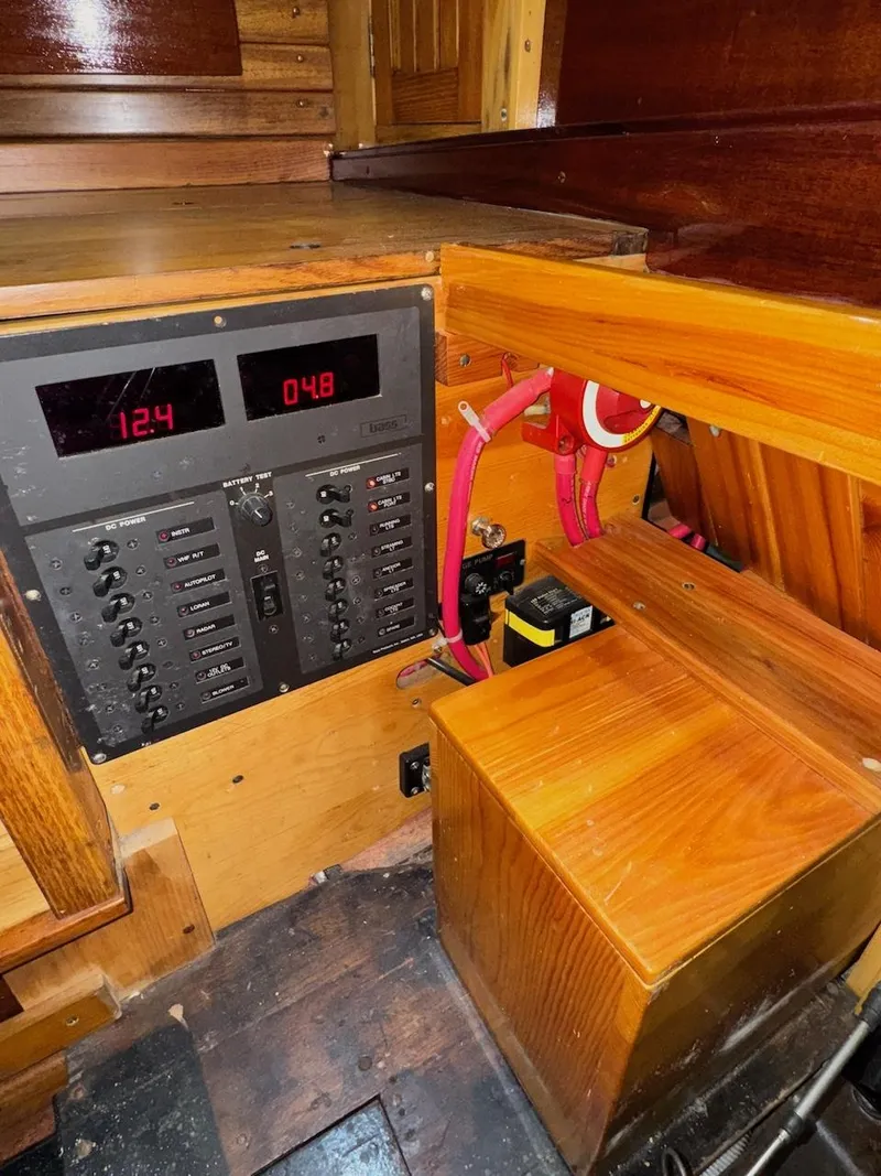 Slide: The Image of Electrical panel of a 1955 Concordia 39 Yawl with digital displays and wooden interior. - 33