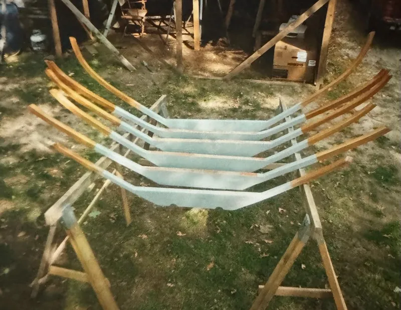 Slide: The Image of Wooden frames for Concordia 39 Yawl, 1955, laid out on sawhorses outdoors. - 45