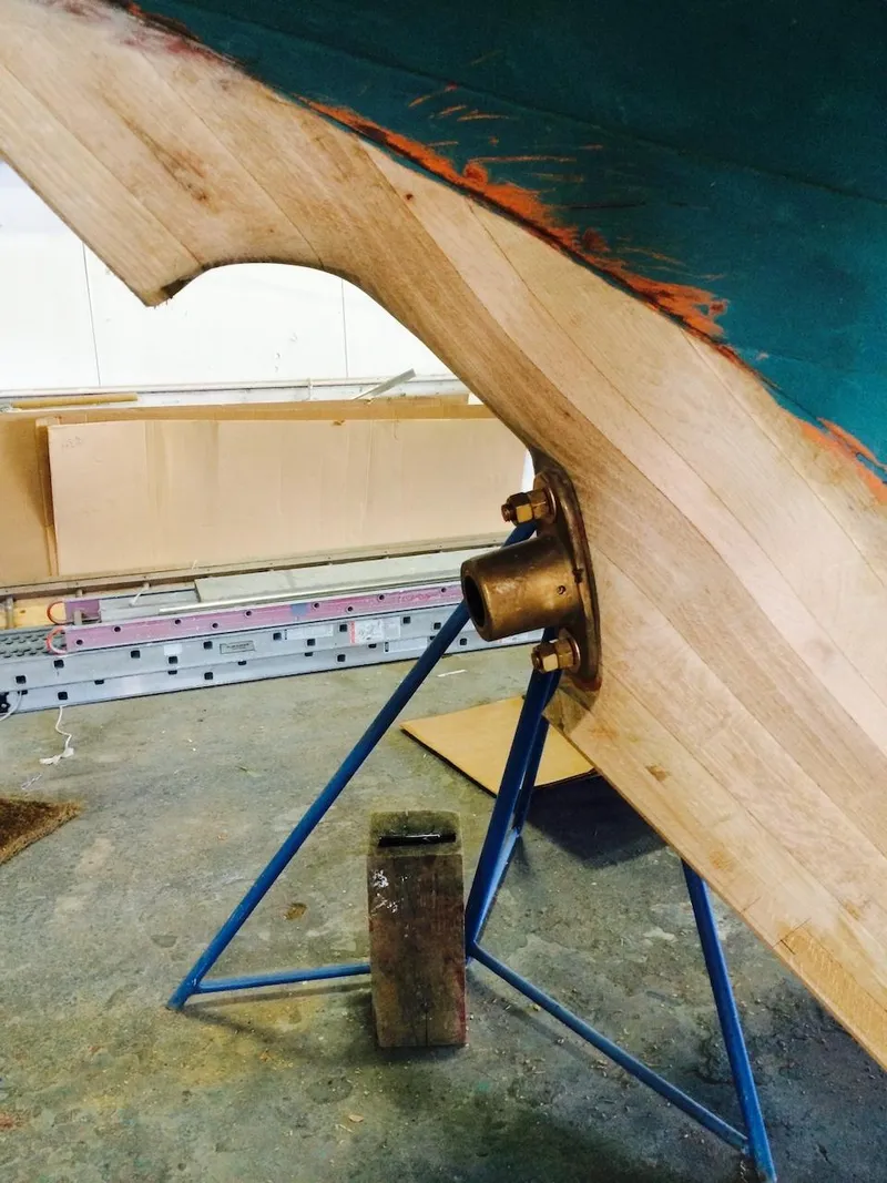 Slide: The Image of 1955 Concordia 39 Yawl under restoration, showcasing hull and propeller shaft detail. - 46