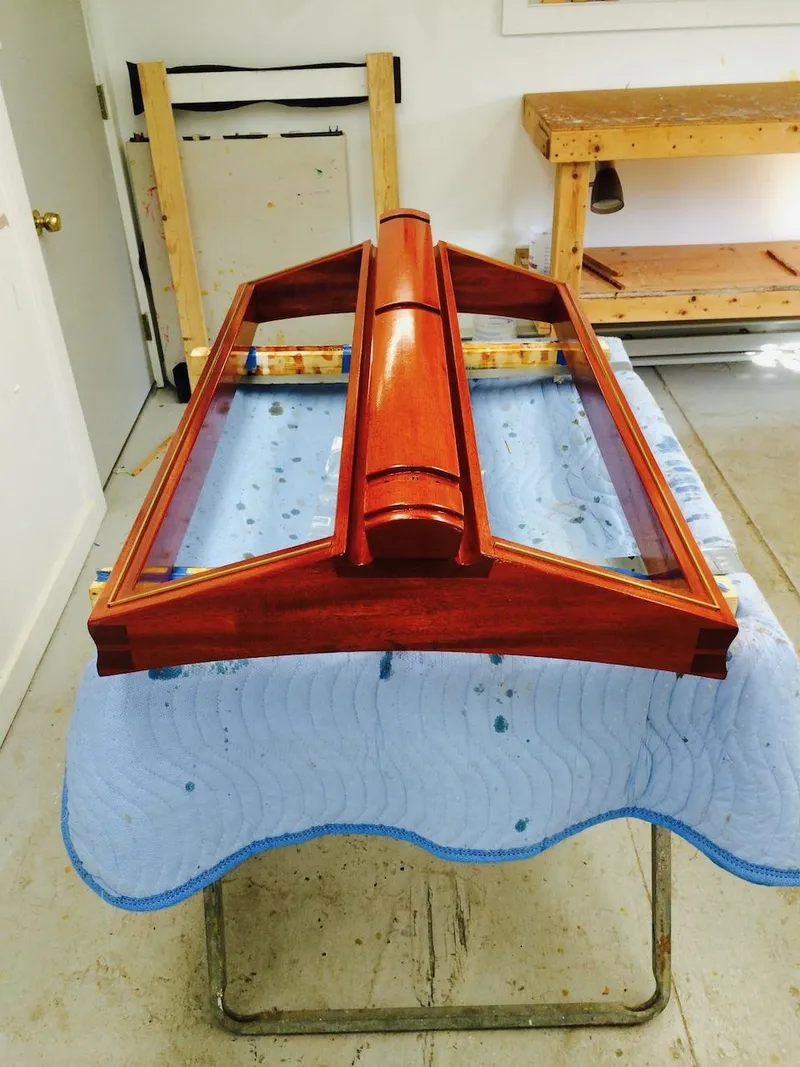 Slide: The Image of 1955 Concordia 39 Yawl wooden hatch on a workshop table. - 47