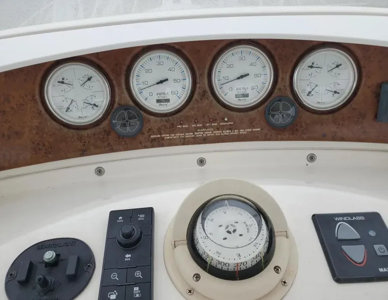 Slide: The Image of Dashboard of a 2005 Silverton 34 Convertible boat with gauges and compass. - 2