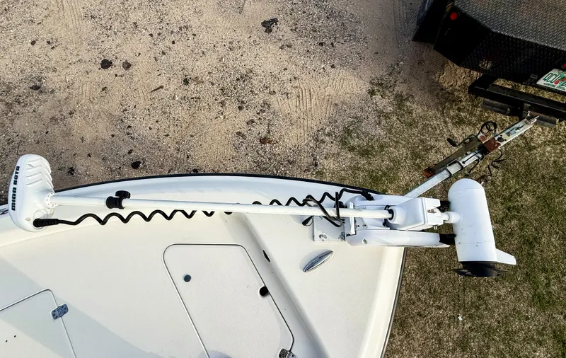 Slide: The Image of 2016 ShearWater 25LTZ boat with trolling motor on sandy ground. - 13