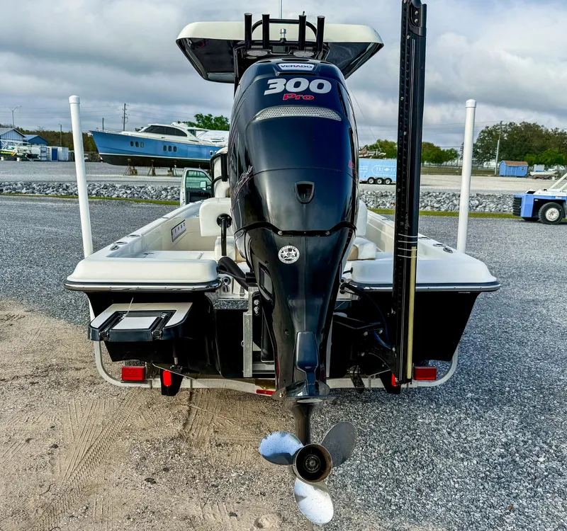 Slide: The Image of 2016 ShearWater 25LTZ boat with powerful 300 HP engine, parked on gravel. - 5