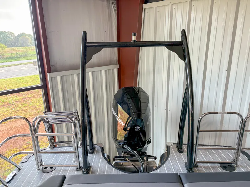 Slide: The Image of 2025 Trifecta 23 UL SS Arch boat with powerful outboard motor in storage. - 10