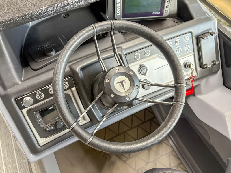 Slide: The Image of Steering wheel and dashboard of 2025 Trifecta 23 UL SS Arch boat. - 14