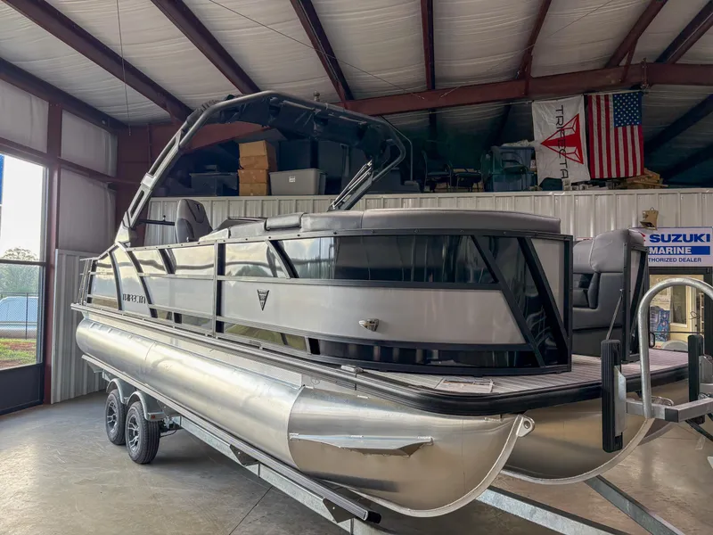 Slide: The Image of 2025 Trifecta 23 UL SS Arch pontoon boat in a warehouse setting. - 3