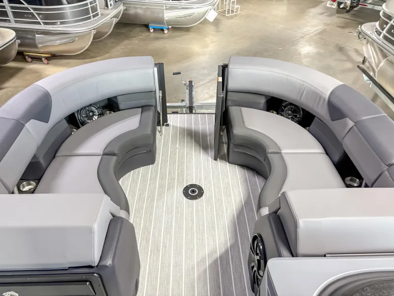 Slide: The Image of 2025 Trifecta 23 UL SS Arch pontoon boat interior with gray seating and flooring. - 8