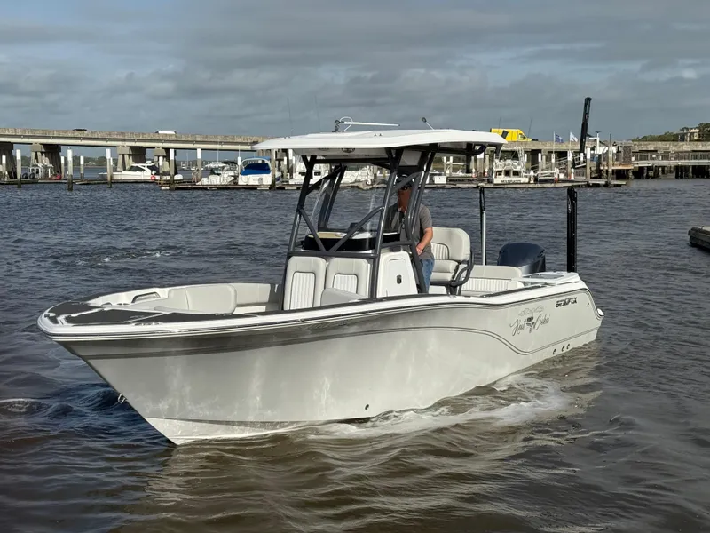 Slide: The Image of 2021 Sea Fox 248 Commander boat cruising on a river near a marina. - 1
