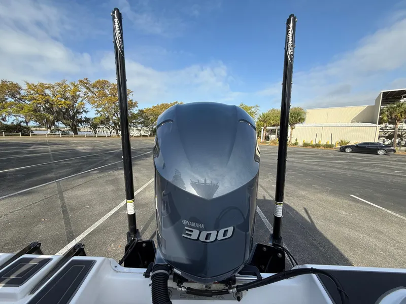 Slide: The Image of 2021 Sea Fox 248 Commander with Yamaha 300 engine in a parking lot. - 12