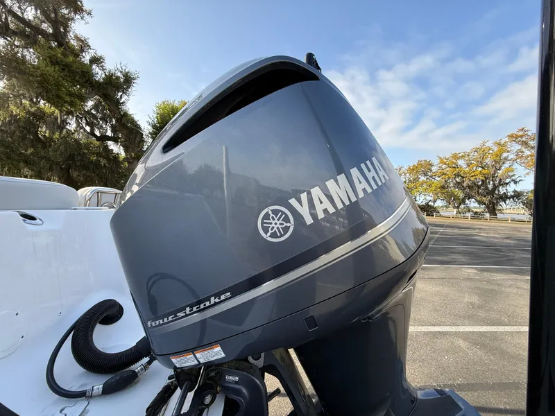 Slide: The Image of Yamaha outboard motor on 2021 Sea Fox 248 Commander boat, parked outdoors. - 13