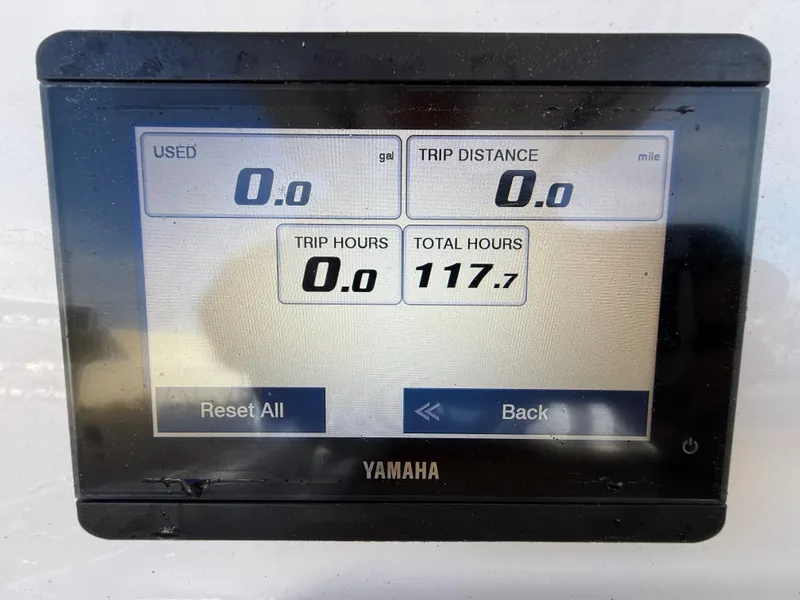 Slide: The Image of Yamaha display showing trip data: 0 gallons used, 0 miles distance, 117.7 total hours. - 17