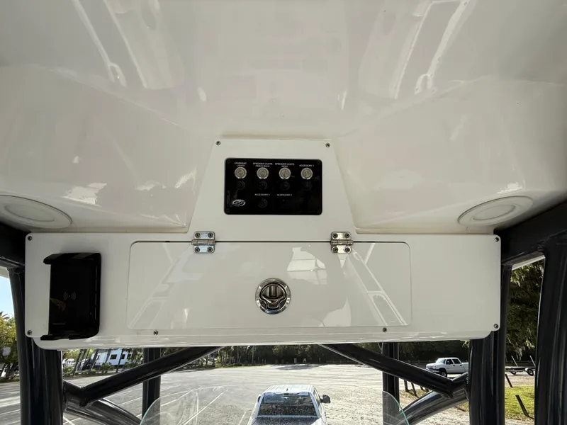 Slide: The Image of 2021 Sea Fox 248 Commander boat console with control panel and storage compartment. - 23