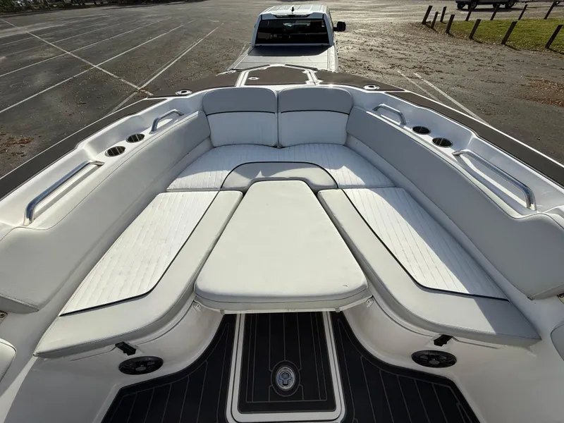 Slide: The Image of 2021 Sea Fox 248 Commander boat with spacious seating and sleek design in a parking lot. - 24