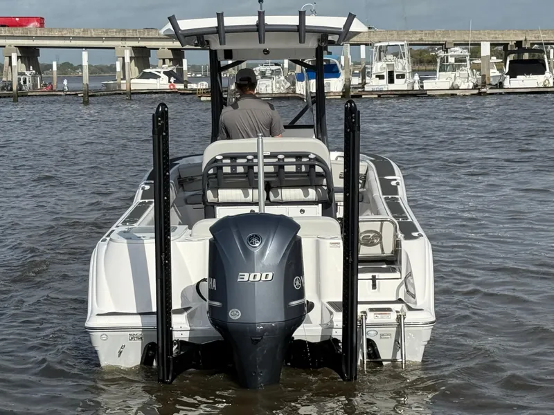 Slide: The Image of 2021 Sea Fox 248 Commander boat with Yamaha 300 engine in a marina setting. - 5