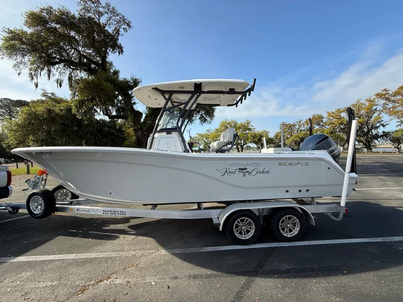 Slide: The Image of 2021 Sea Fox 248 Commander boat on trailer in sunny parking lot. - 6