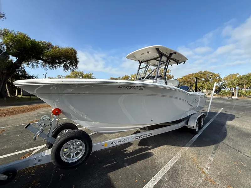 Slide: The Image of 2021 Sea Fox 248 Commander boat on trailer in sunny parking lot. - 7