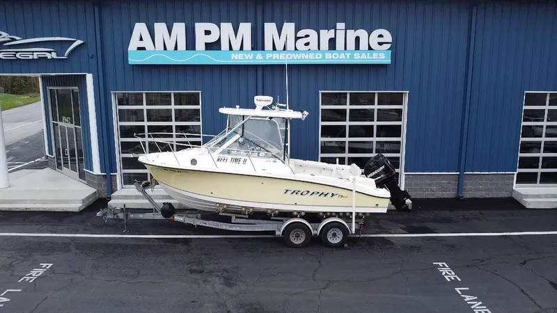 Slide: The Image of 2007 Trophy 2302 Walkaround boat on trailer outside AM PM Marine dealership. - 1