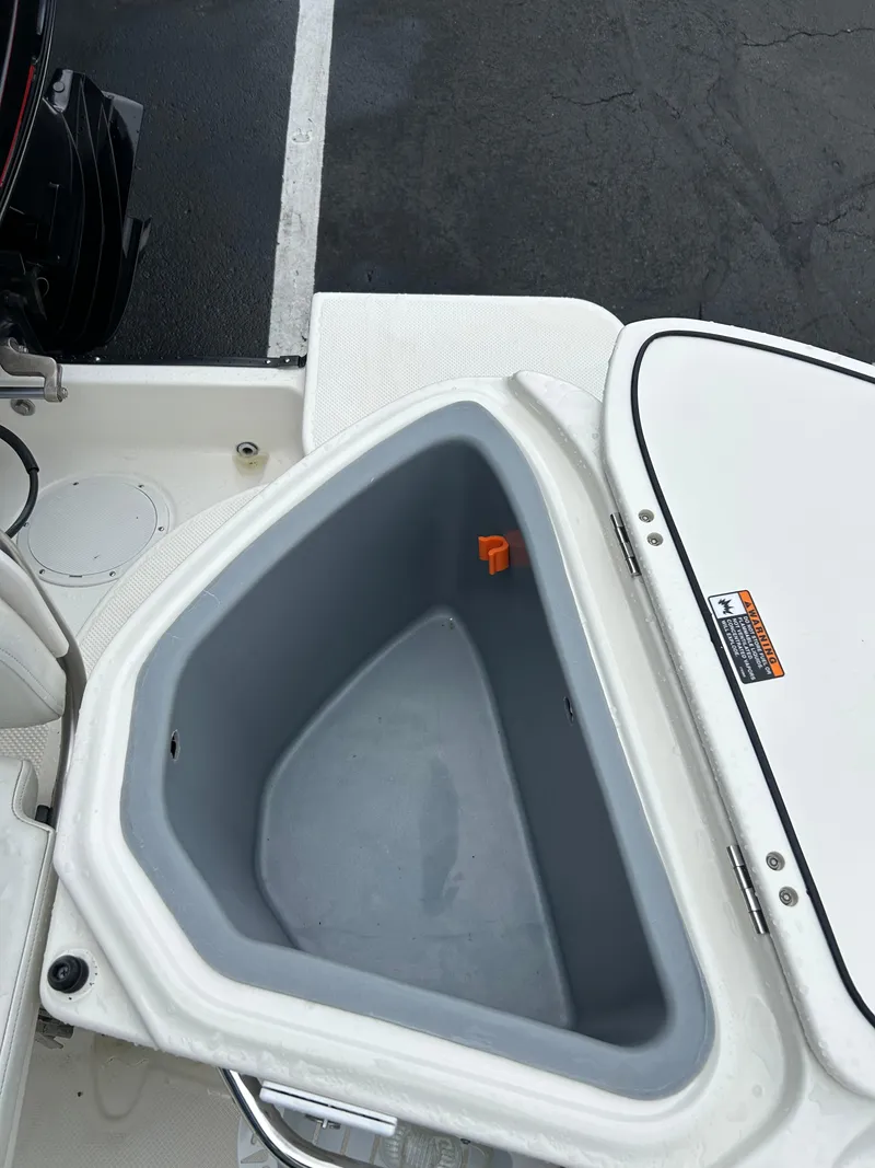 Slide: The Image of 2007 Trophy 2302 Walkaround boat storage compartment, open and empty. - 8