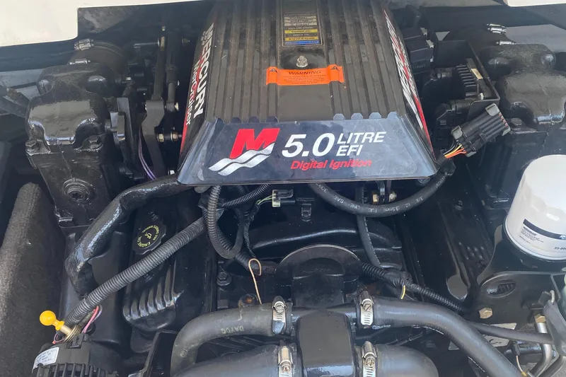 Slide: The Image of 5.0 Litre EFI engine of a 2002 Cobalt 190 boat, featuring digital ignition. - 5