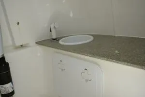 Slide: The Image of 2023 Sea Pro 239 Deep V CC trailer with dual wheels and metallic fenders. - 10